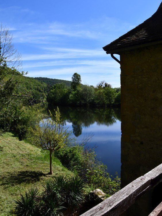 garden on a beautiful riverbank, viewed from an upper floor of the stone mill